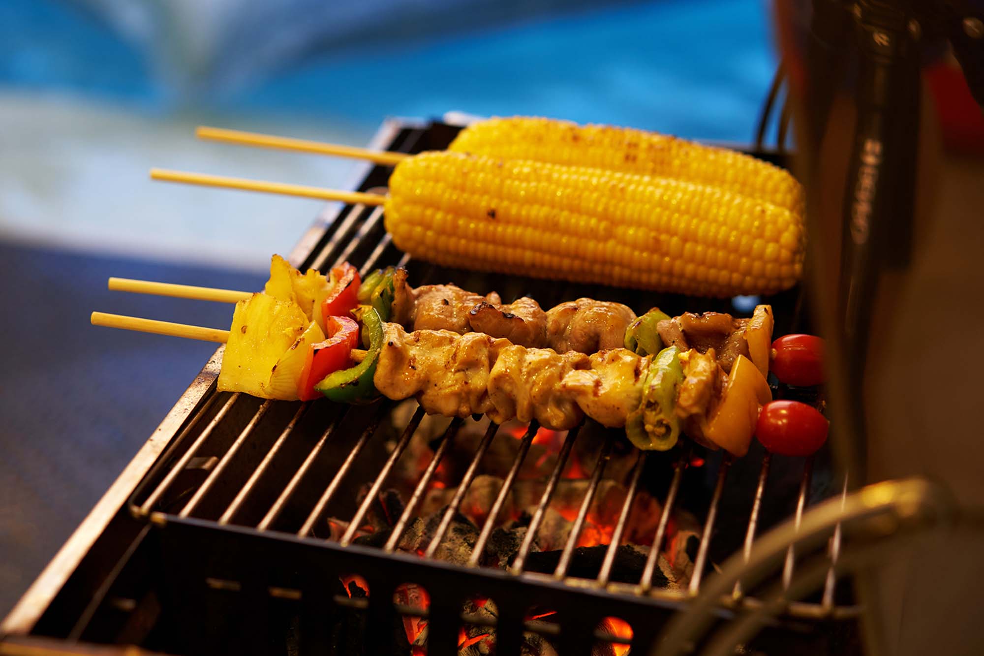 Kebabs and corn on a bbq