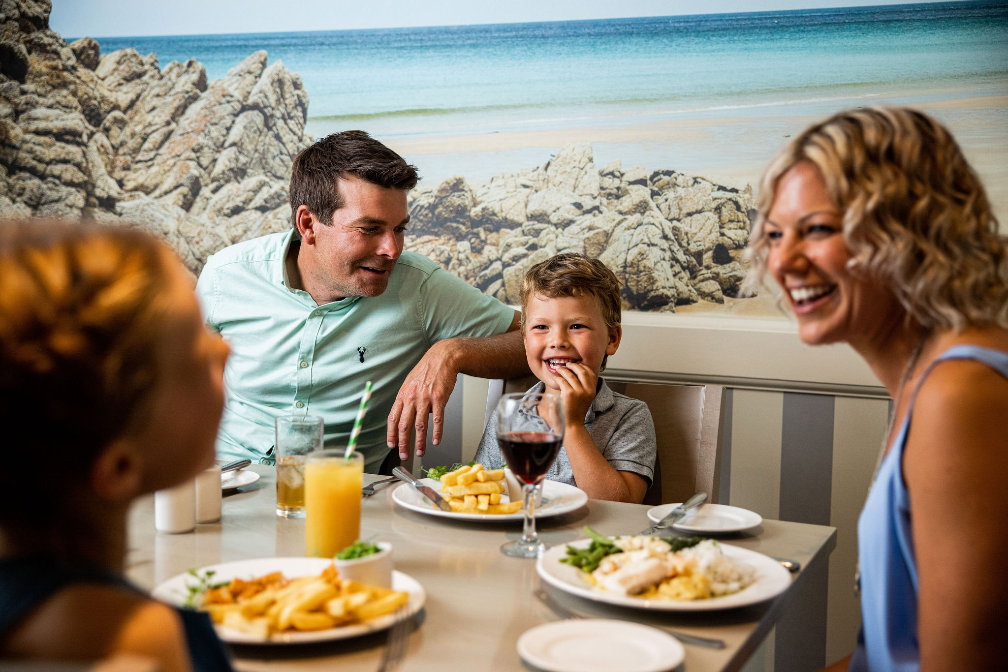 Happy family has dinner at The Belvedere restaurant